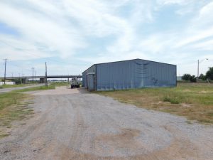 9/29 SHOP BUILDING * .7 +/- ACRES * COMMERCIAL PROPERTY * ENID, OKLAHOMA 4,750 SQ.FT.  OF SHOP AREA * BLACKTOP FRONTAGE