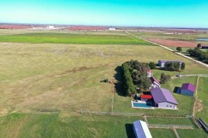 11/19 160± Acres * Omega / Watonga Area Barndominium * Machine Shed * Swimming Pool * Ponds * 3-Car Insulated Garage * Corral * Continuous Fence